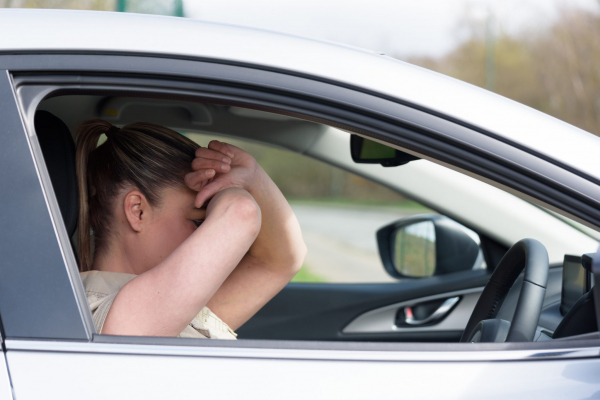 frustrated woman in car